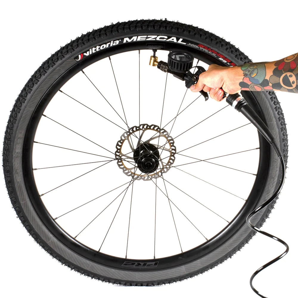 VIAIR TLC inflator being used to seat a Vittoria Mezcal tubeless tire